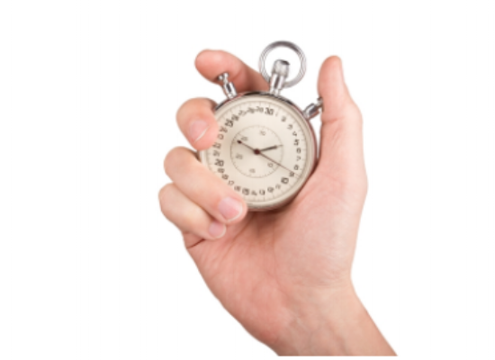 A hand holding a stopwatch