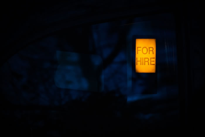 have you ever been ghosted - showing a "for hire" light in a dark room